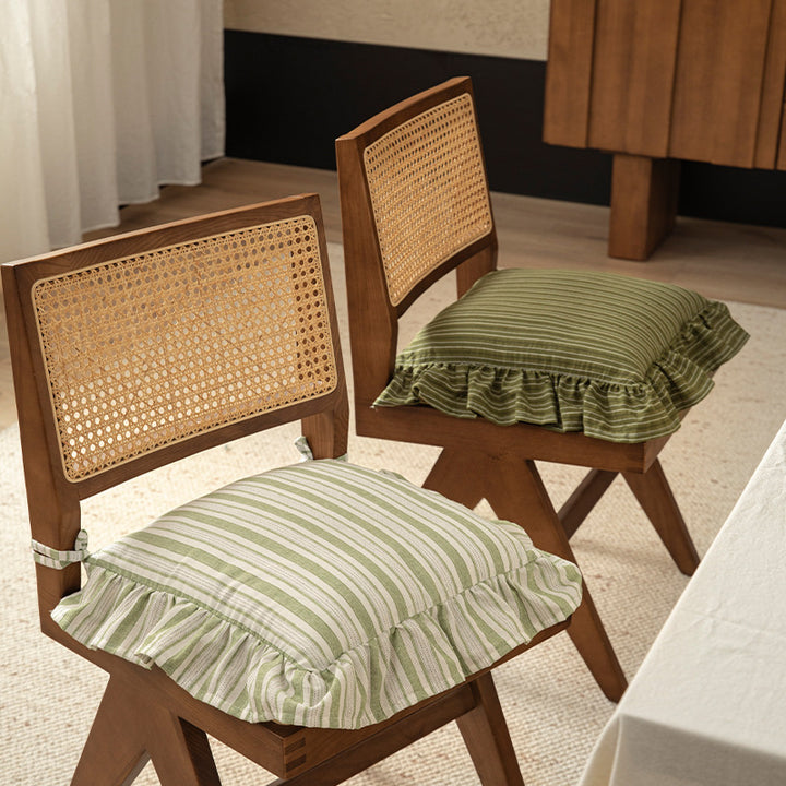 Striped chair cushion with ties, ruffled hem and linen look