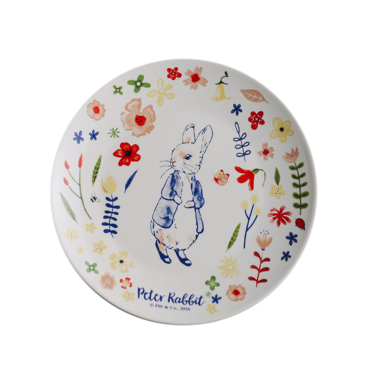 Children's plate made of porcelain with rabbit illustration and floral decoration