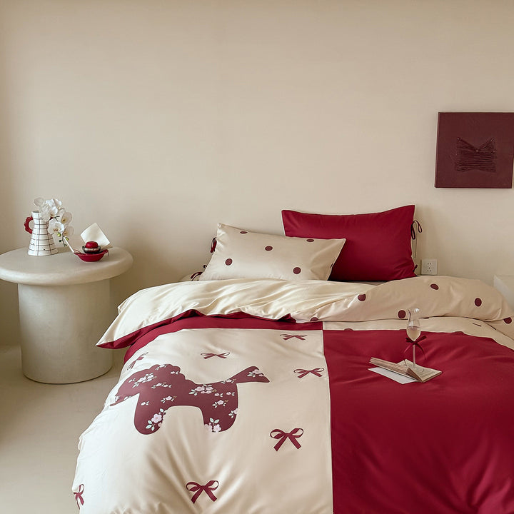 Reversible bedding set with decorative dog and dot pattern as well as pillowcases with ties