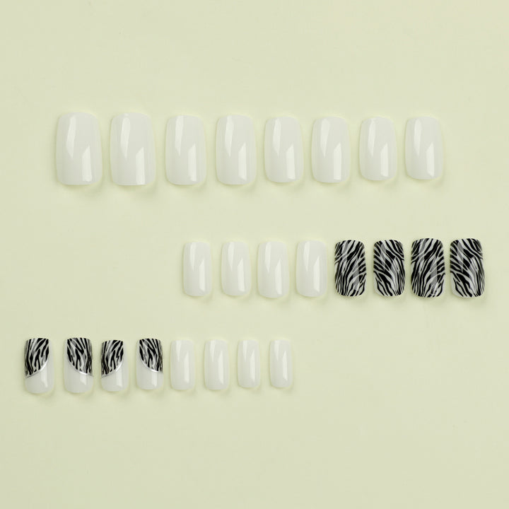 Artful nail extensions with stylish zebra pattern Kalsten