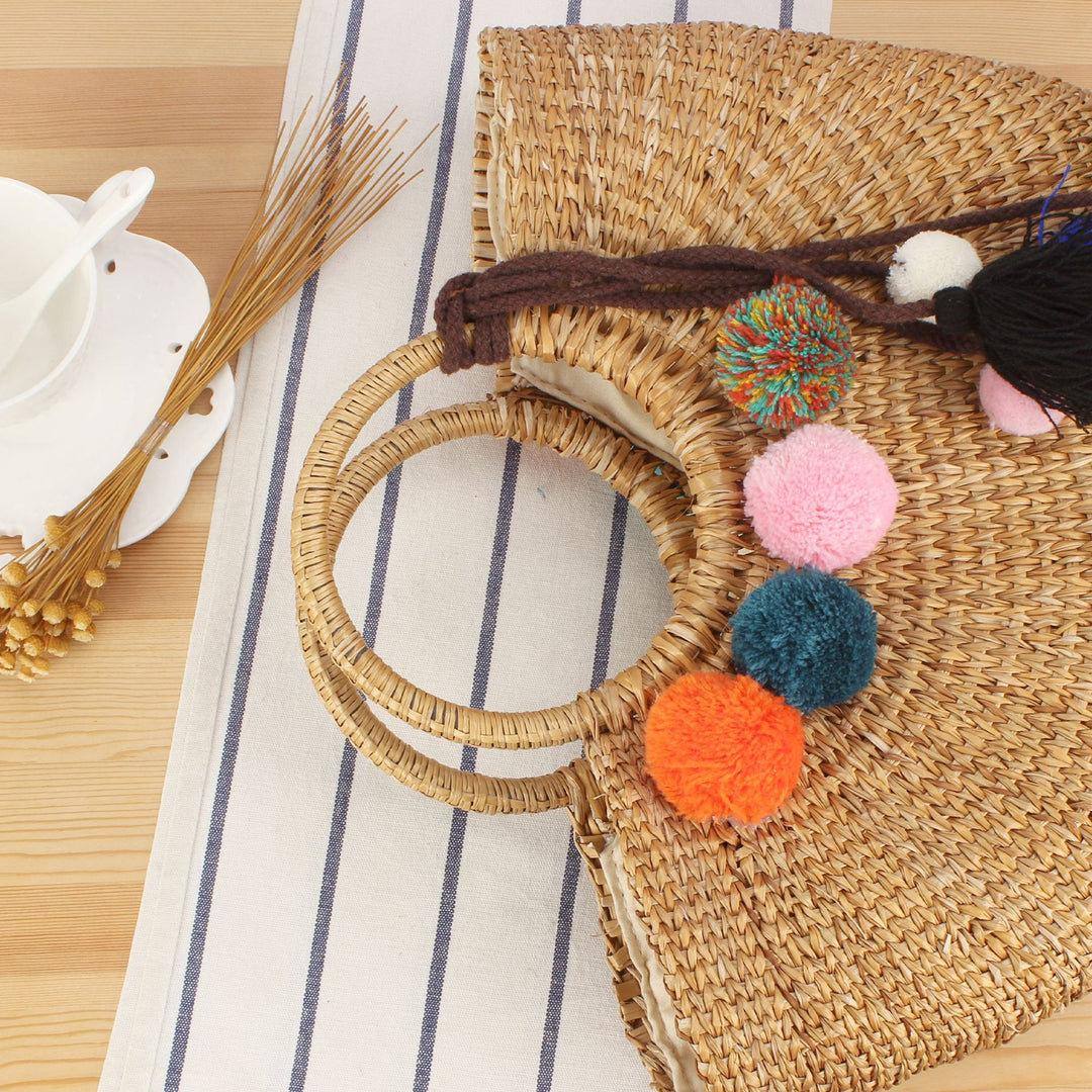 Straw handbag with colorful tassels and pom poms Kalsten
