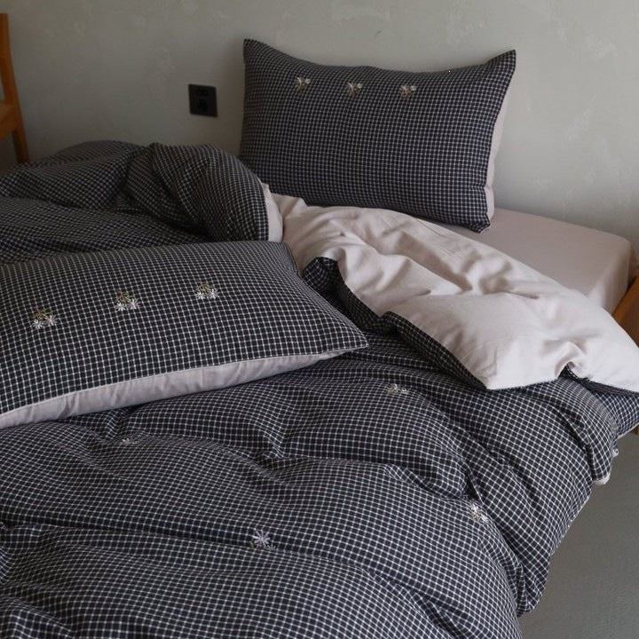 Cotton bedding set with fine check pattern, black reversible side and embroidered heart accents