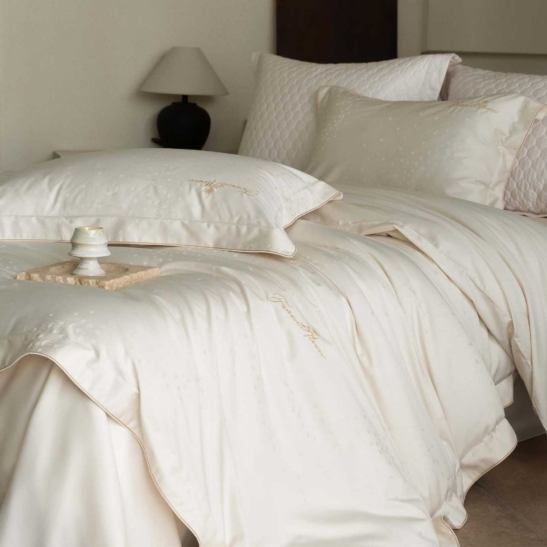 Luxurious satin bedding complete set with quilted cover and delicate logo embroidery
