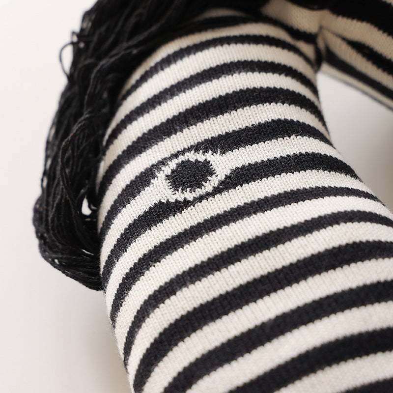 Striped decorative knitted cushion in animal shape with fringes and four-legged look Kalsten