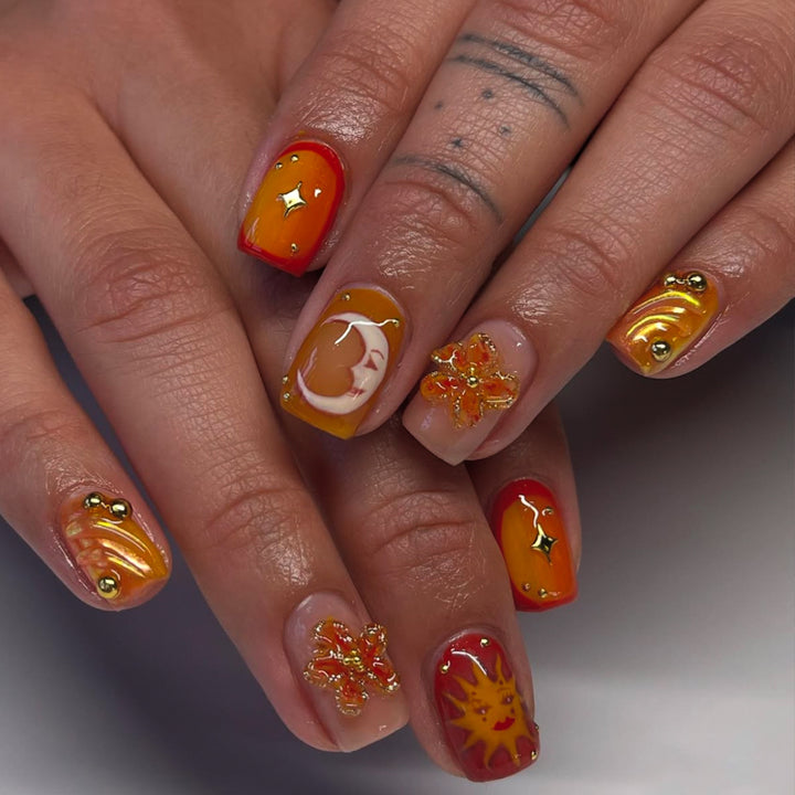 Artificial nails with floral motifs and glitter accents Kalsten