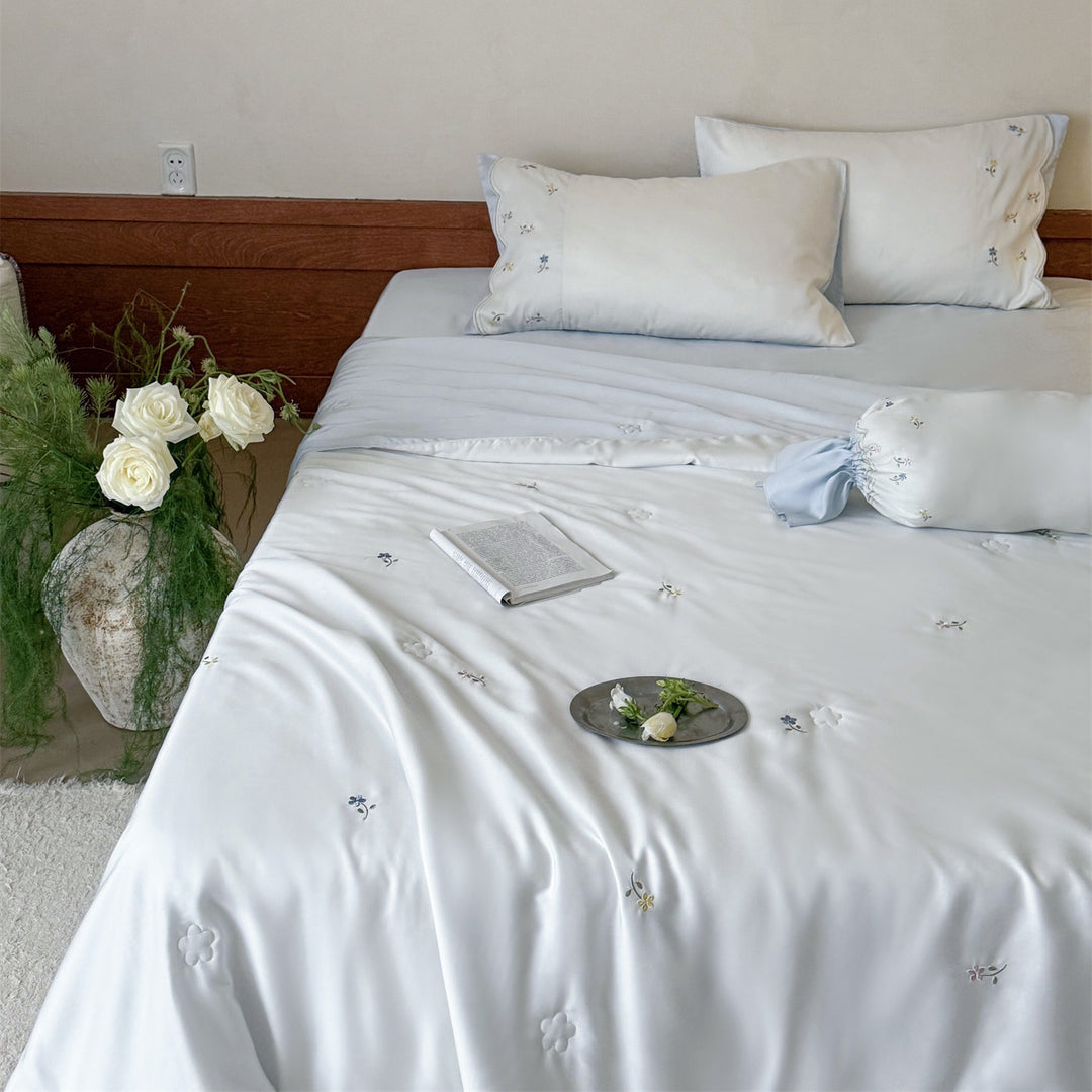 Embroidered satin bedding set with fine floral embroidery and silky-soft touch