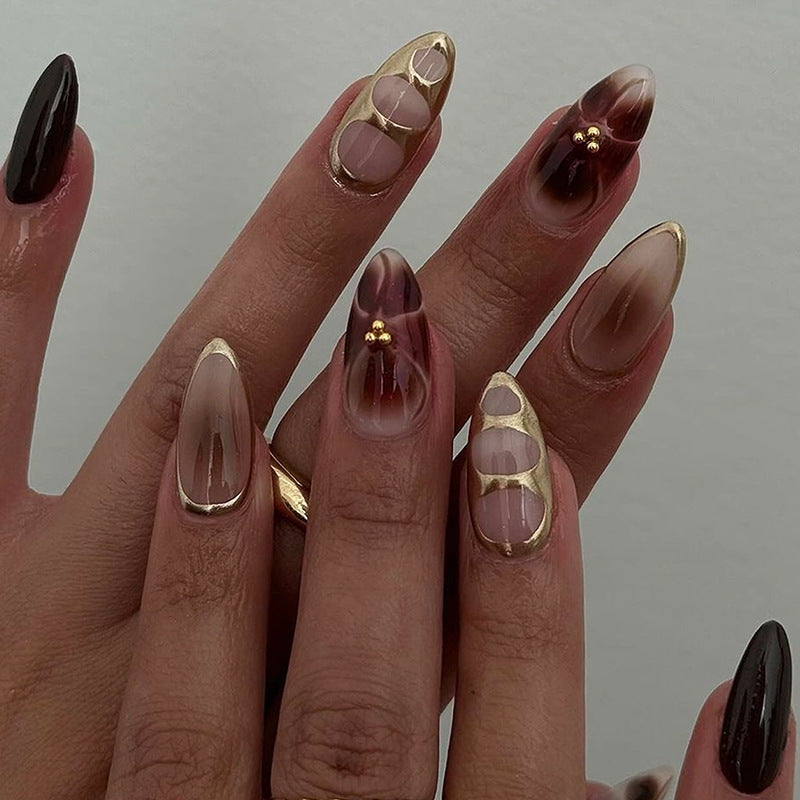 Acrylic nail set with elegant floral accents and luxurious details Kalsten