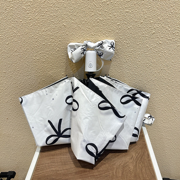 Women's foldable umbrella with elegant bow design Kalsten