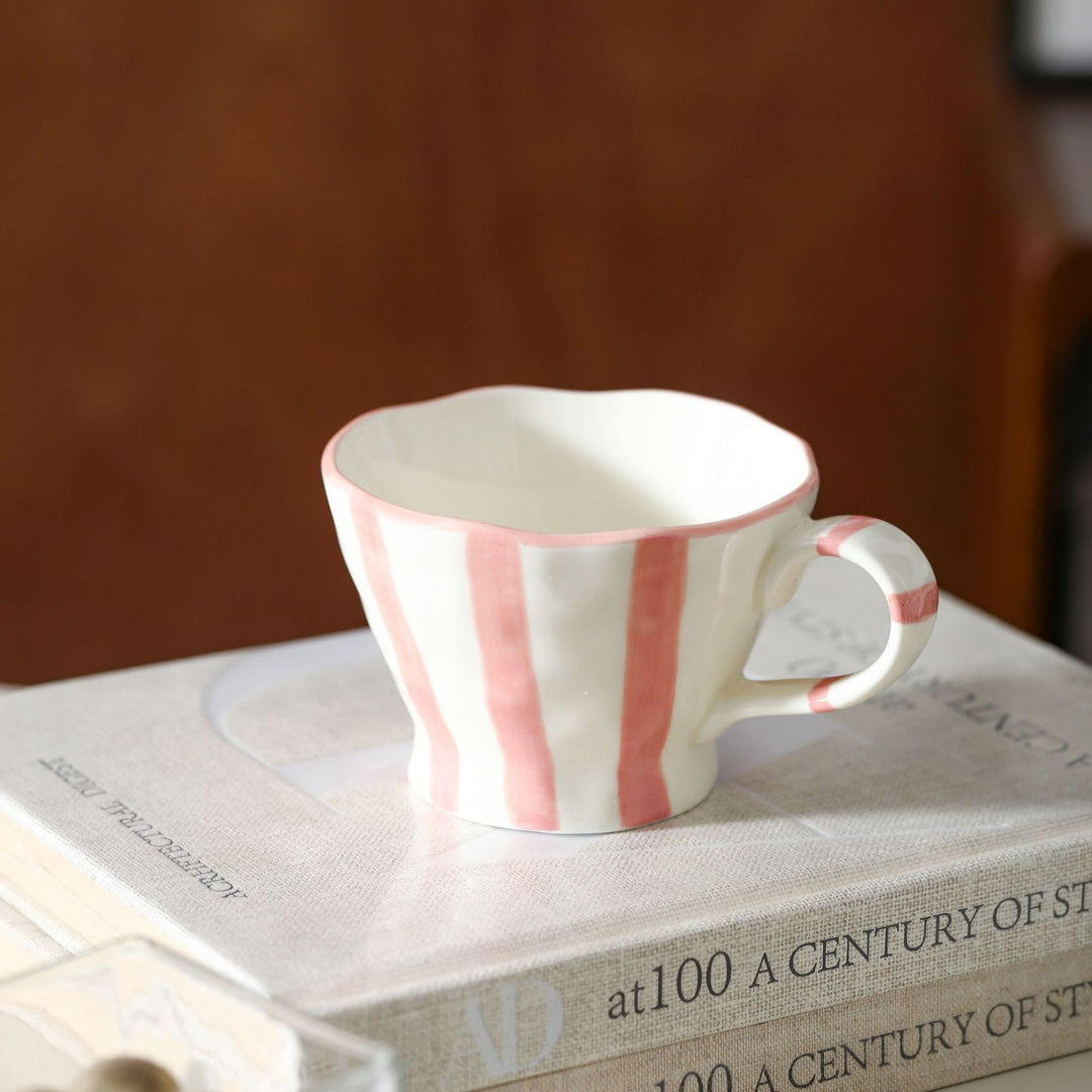 Designer stoneware coffee mug with scalloped rim and vertical brushstroke