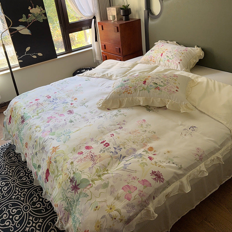 Cotton satin bed linen set with delicate watercolor botanical print and decorative ruffle