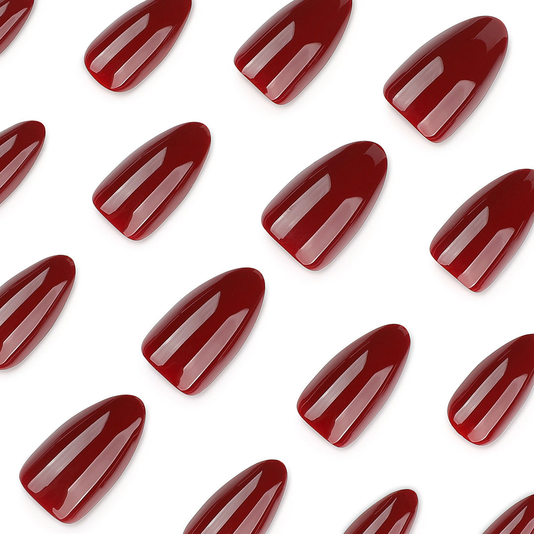 Glamorous stiletto nails with high gloss and elegant design accents Kalsten
