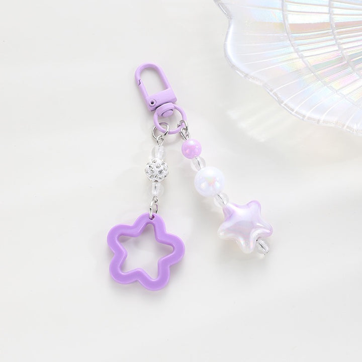 Playful keychain with floral and star motif Kalsten