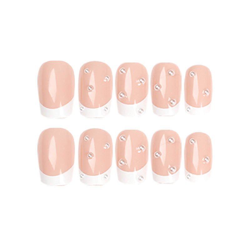 Artful nail art with elegant pearl and glitter accents Kalsten