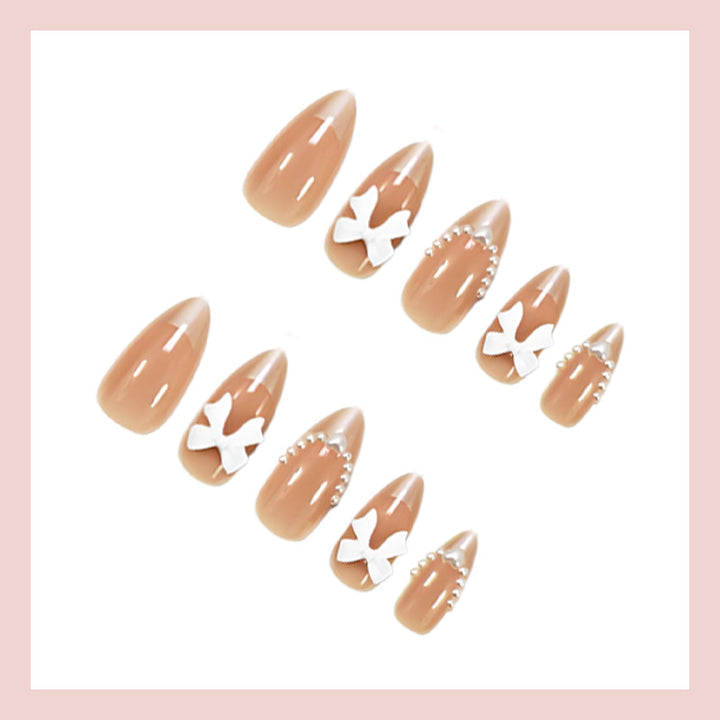 Artificial nail set with elegant bows and glitter details Kalsten