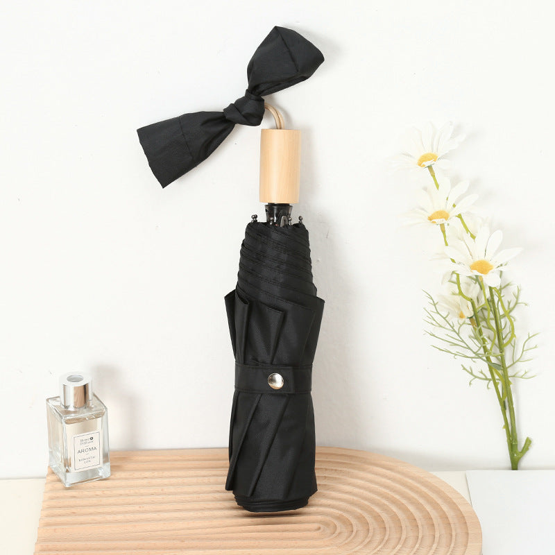 Ladies compact folding umbrella with elegant design and ergonomic wooden handle Kalsten