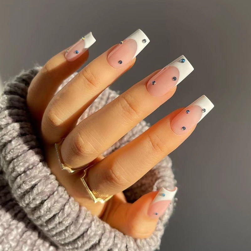 Artistic artificial nails in elegant French tip design with glitter accents Kalsten