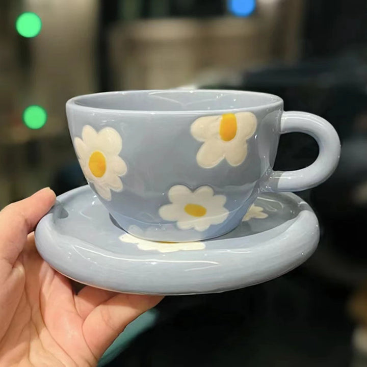 Large ceramic bowl as coffee and tea cup with matching saucer and decorative flower appliqués