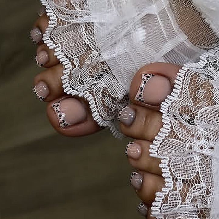 Artistic toenail design with elegant tips Kalsten
