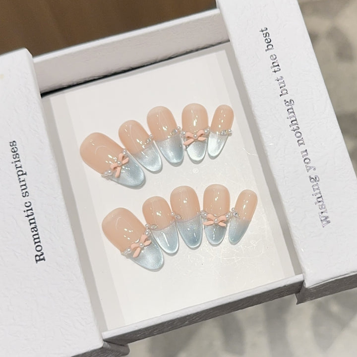 Artificial nail set with romantic bow and glitter accents Kalsten