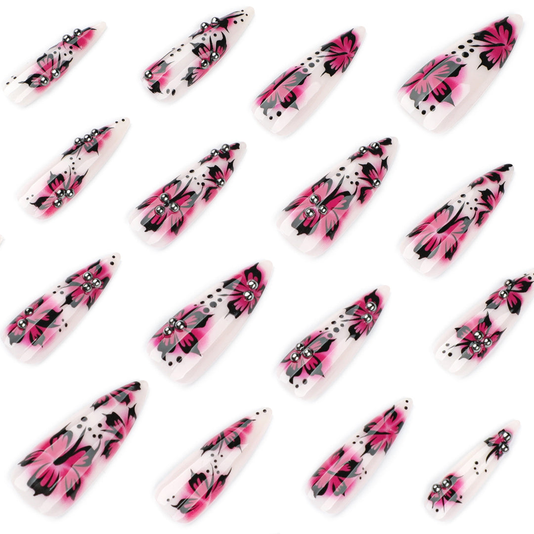 Artful nail art with floral design and rhinestone accents Kalsten