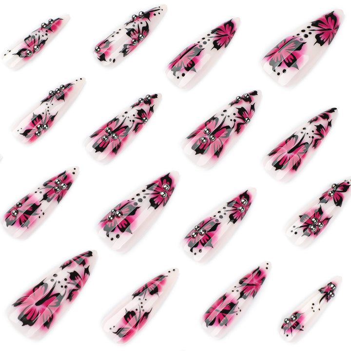 Artful nail art with floral design and rhinestone accents Kalsten