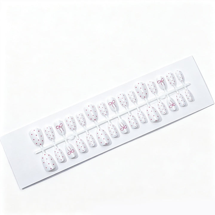 Artificial nail set with delicate dots and bow pattern Kalsten