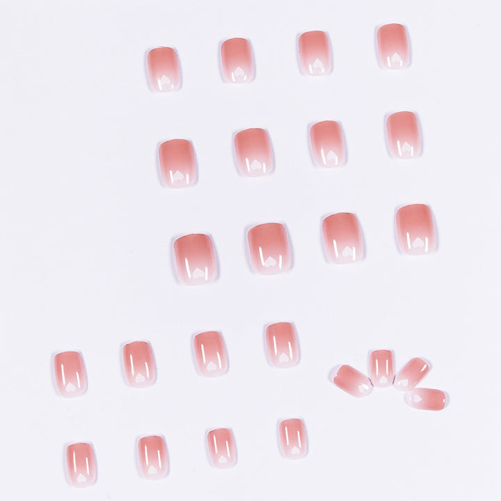 Artful nail art with heart-shaped accents and gentle ombre effect Kalsten