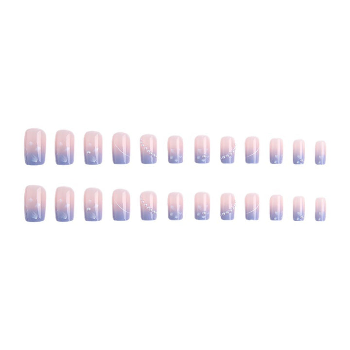 Nail set with elegant floral accents and glitter embellishments Kalsten