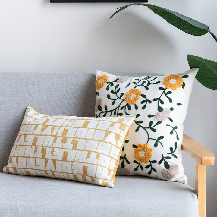 Embroidered square cushion cover made of cotton-linen with tufted flower appliqué