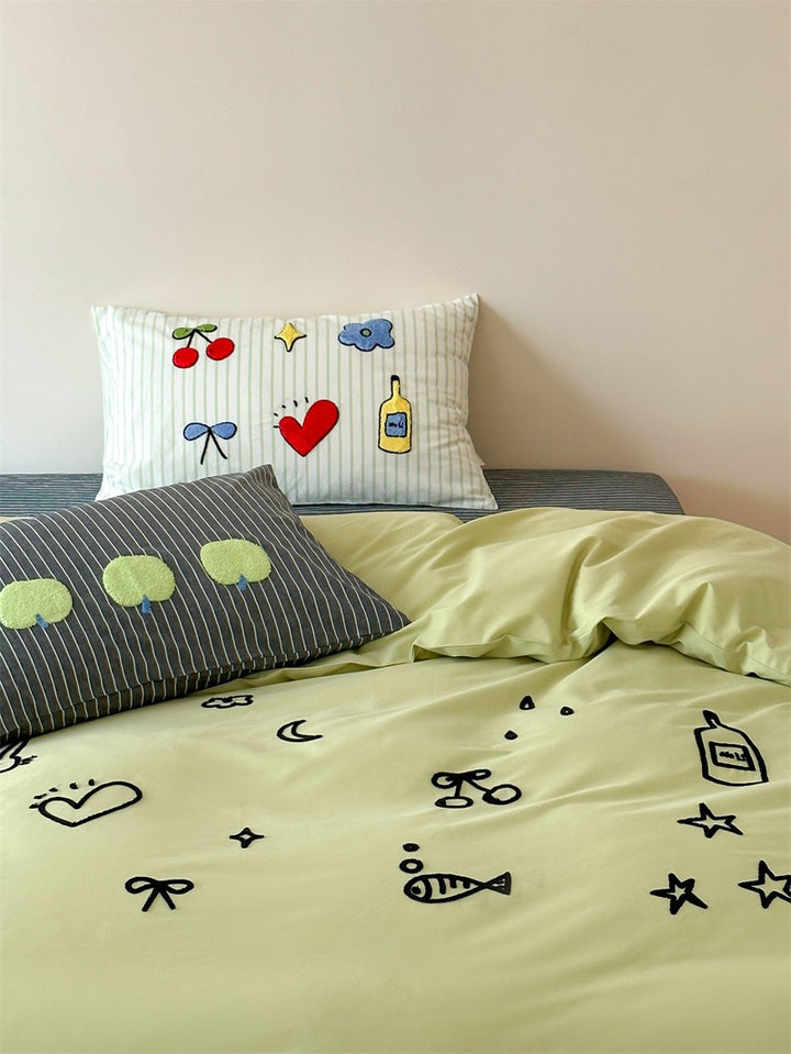 Playful cotton duvet cover set with embroidered motifs and soft fitted sheet