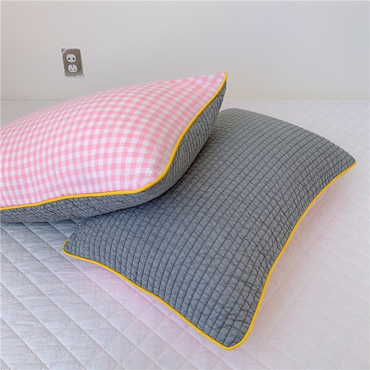 Reversible quilted pillow set with checked cotton cover and contrasting piping