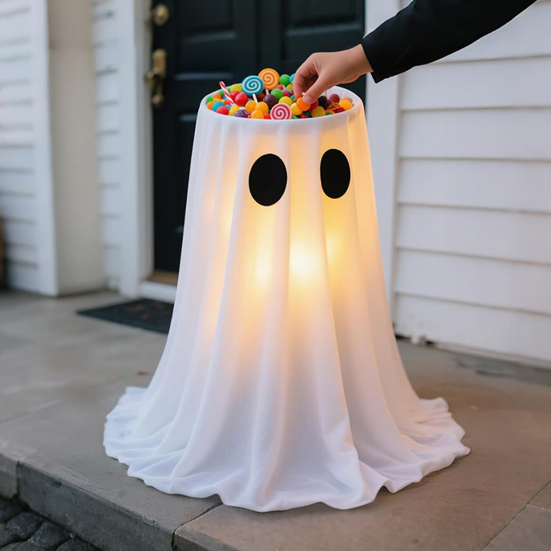 Glowing Halloween candy bowl with ghost wrap and LED interior lighting