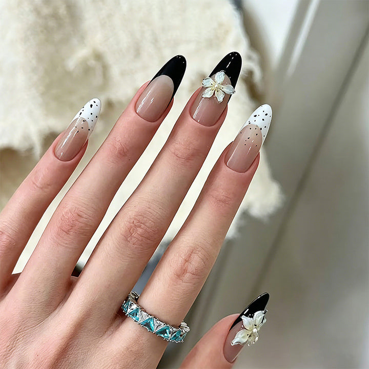 Artful nail tips with floral embellishments Kalsten