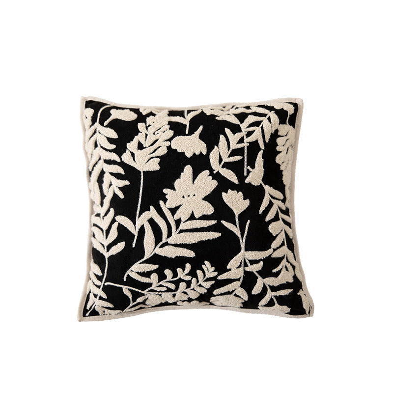 Square decorative pillow with floral flock embroidery and fine piping edge