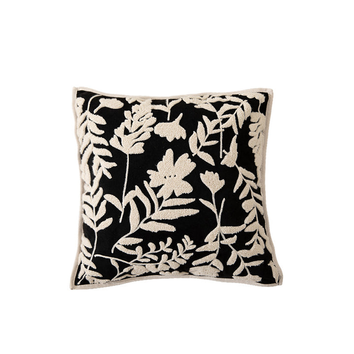 Square decorative pillow with floral flock embroidery and fine piping edge