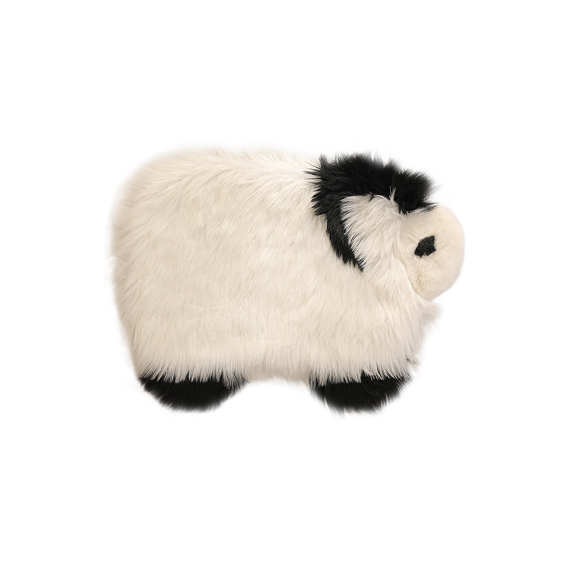Plush seat pouf in sheep shape with cuddly faux fur cover