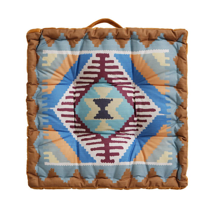 Square seat cushion with kilim-inspired pattern, quilted padding and carrying handle
