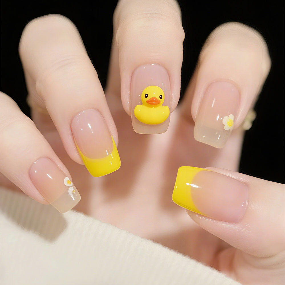 Artificial nails with playful duck motif and spring accents Kalsten