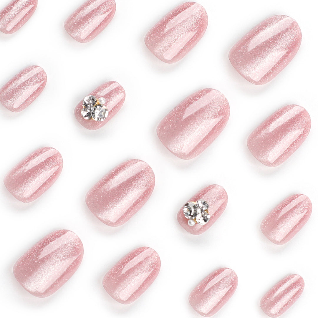 Artful glitter nail extensions with elegant rhinestone accents Kalsten