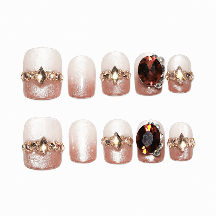 Artificial nail art with glitter and jewelry embellishments Kalsten