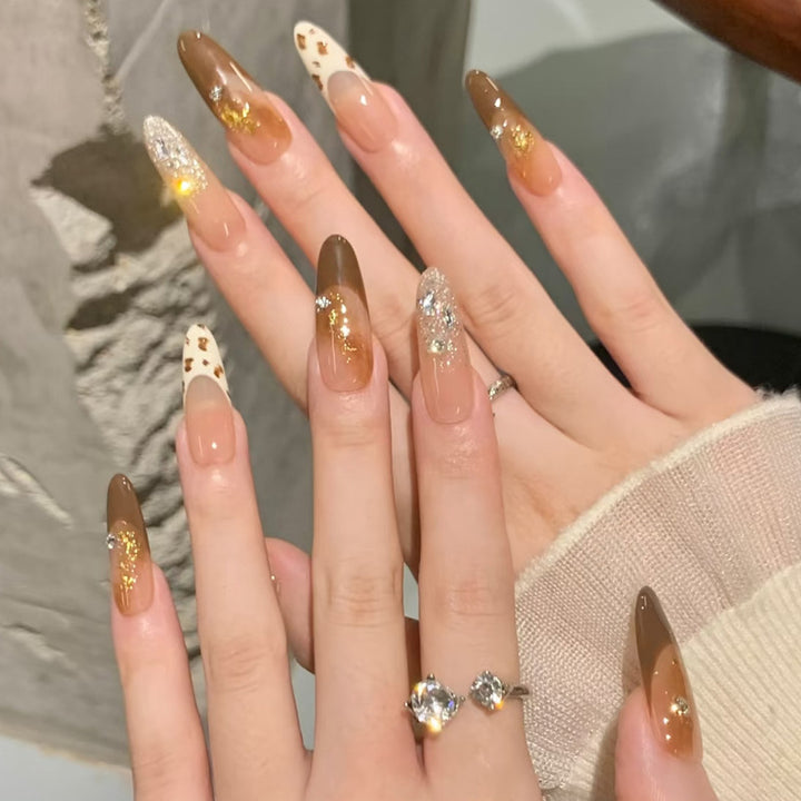 Glamorous artificial nails with creative embellishments Kalsten