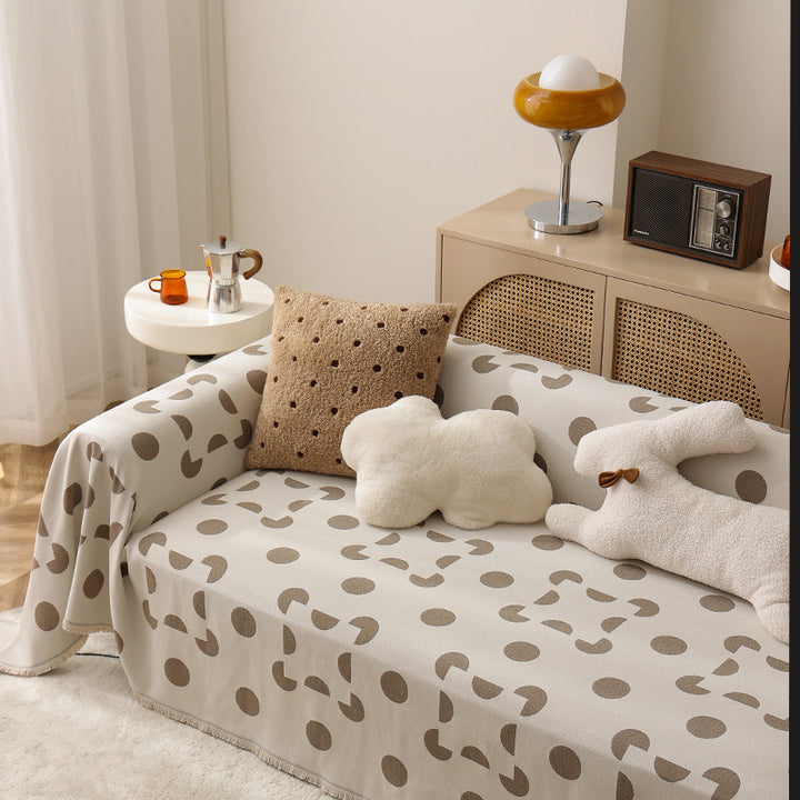 three-seater universal protective cover made of jacquard fabric with geometric pattern