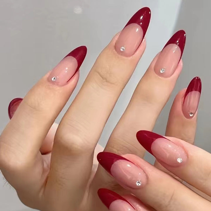 Elegant Stiletto Nail Art with Rhinestone Accents