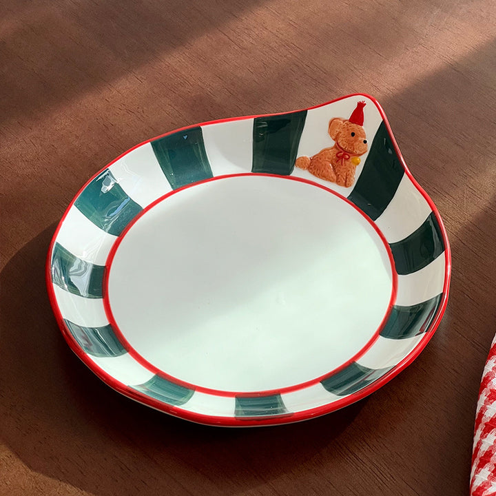 Decorative ceramic deep plate with pouring spout, striped rim and bear motif