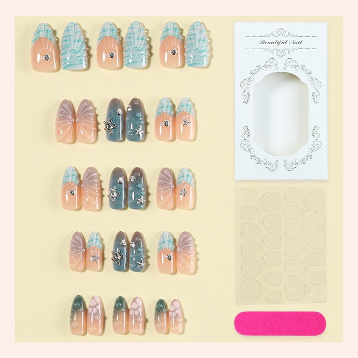 Artificial nail set with elegant shell pattern and 3D accents Kalsten