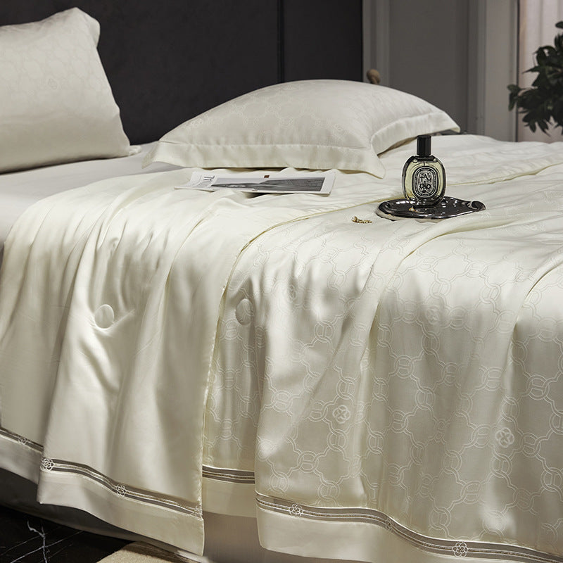 Luxurious quilted bedspread with satin jacquard and decorative border