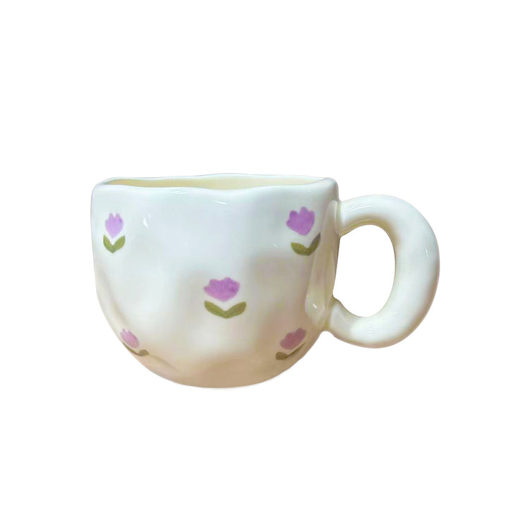 Ceramic mug with hand-painted tulip pattern and organic shape