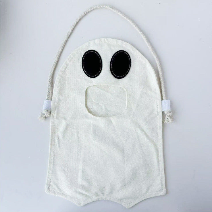 Children's candy tote bag with carrying slot, drawstring and pumpkin appliqué