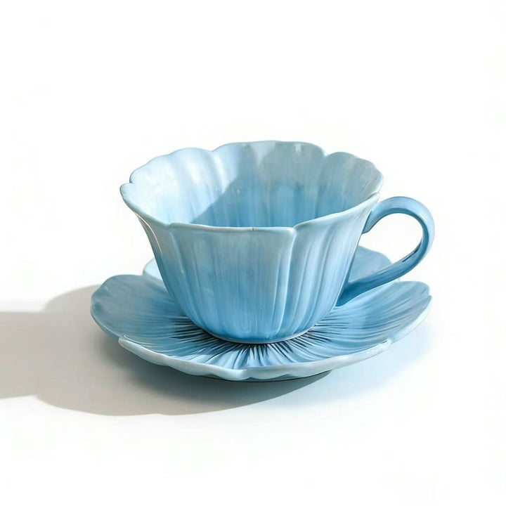 Ceramic mug with saucer in flower shape