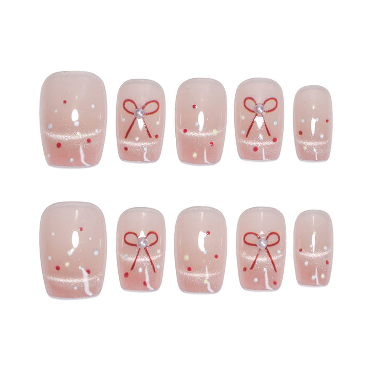 Artificial nail art with elegant bows and glitter accents Kalsten